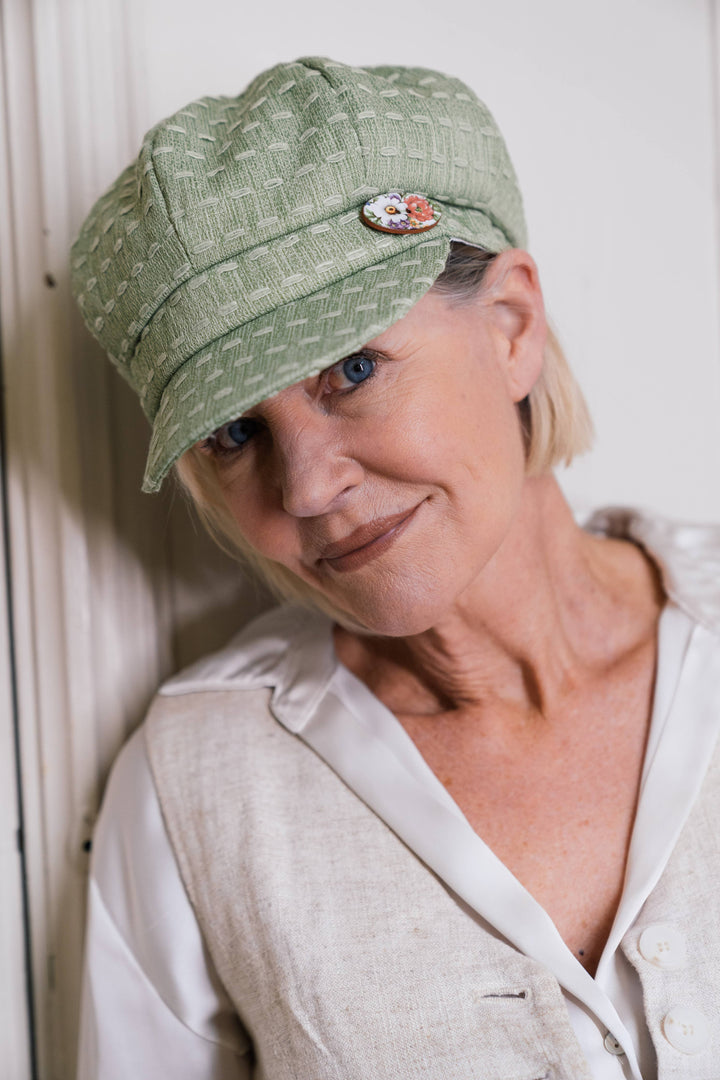 Ladies Green Baker Boy Cap, Trimmed with a Hand Painted Floral Pottery Button