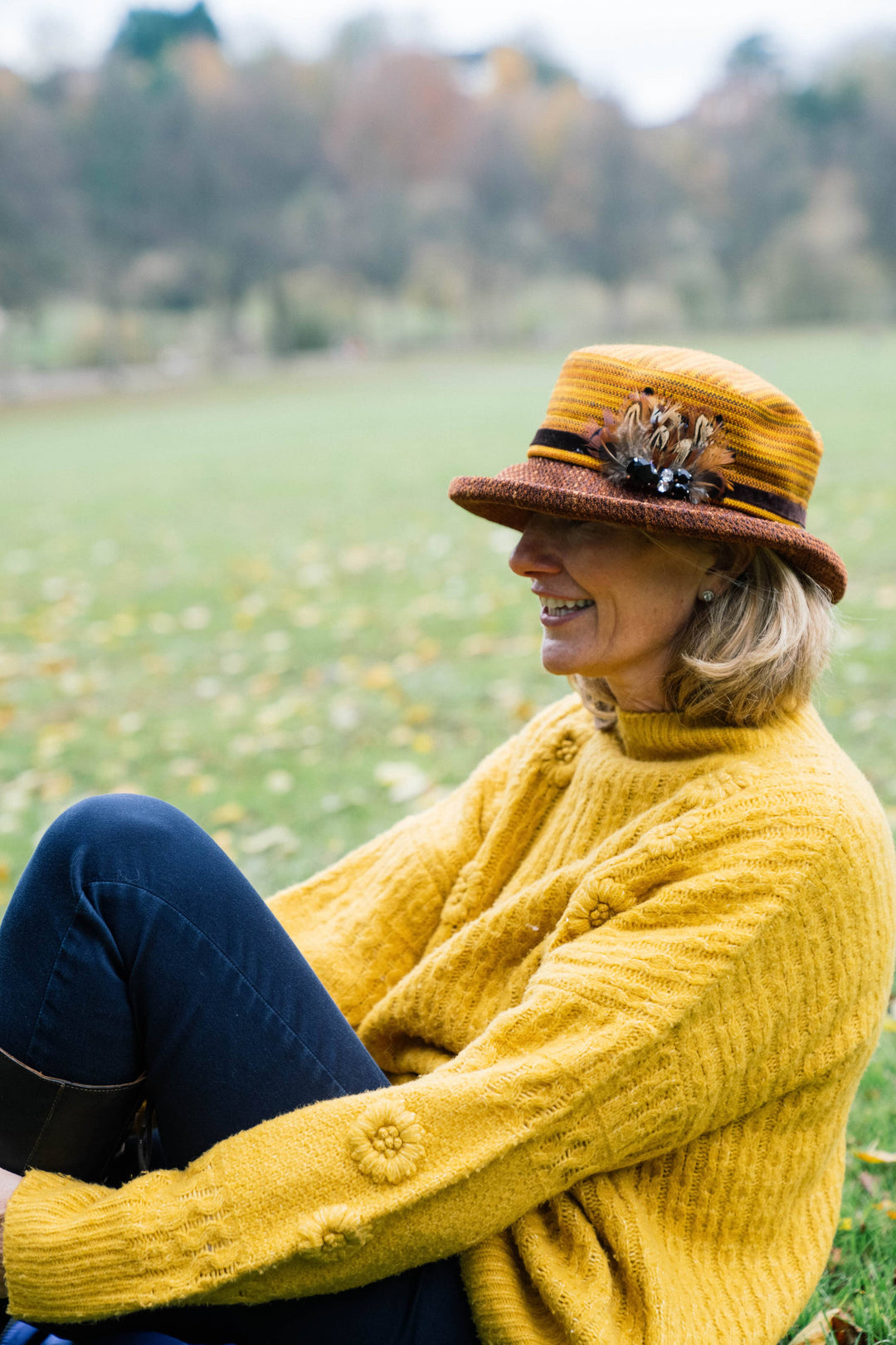 Limited Edition Autumn Woven Chenille Rich Autumn Coloured Hat with Feather Decoration.
