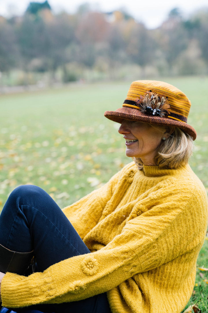 Limited Edition Autumn Woven Chenille Rich Autumn Coloured Hat with Feather Decoration.